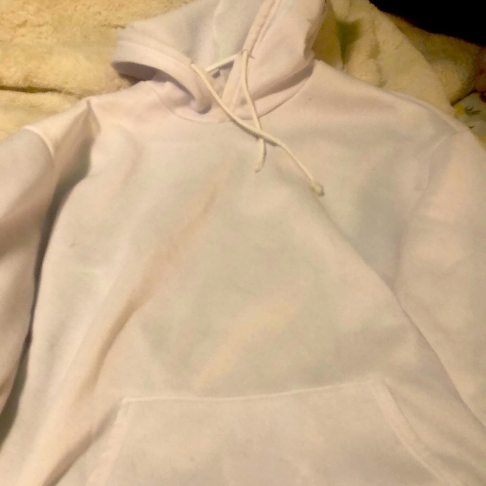 A white hoodie with yellow roses